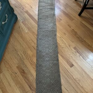 Brown Patterned 12 x 78” runner with fringe at the end thick